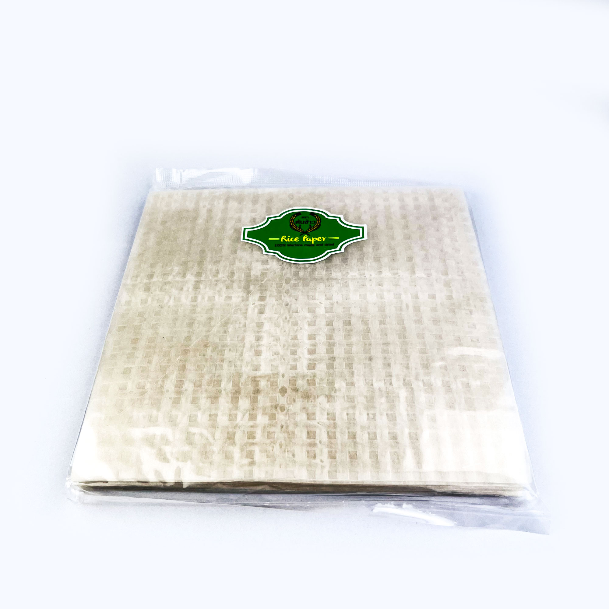 แผ่นแป้งตราต้นข้าวเขียว  แผ่นแป้งสลัดโรล หรือ ใบเมี่ยงห่อสลัด ตราต้นข้าวเขียว ขนาด 22 x 22 เซน ถุงละ 500 กรัม