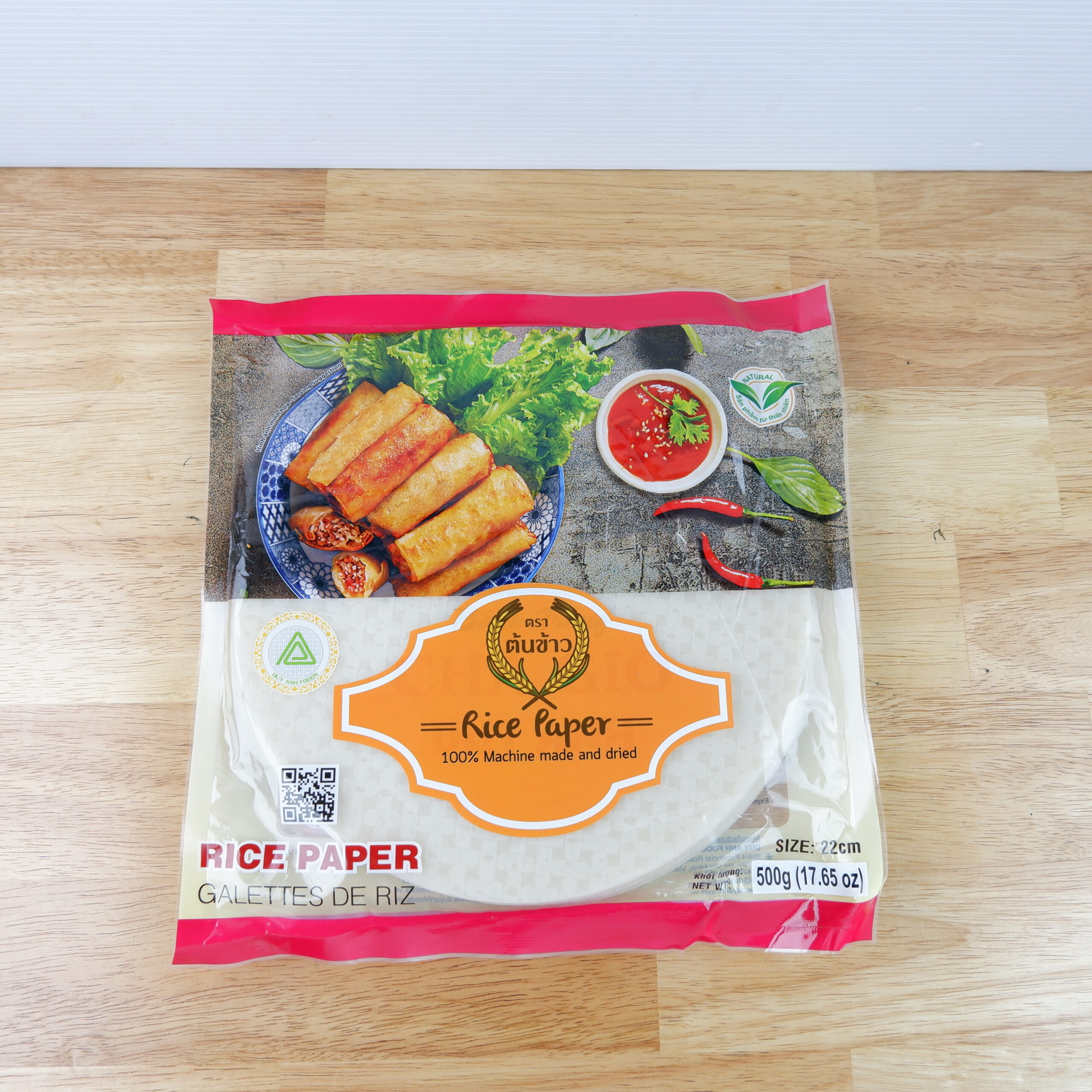 แผ่นปอเปี๊ยะ ตราต้นข้าว  แผ่นแป้งสลัดโรล หรือ ใบเมี่ยงห่อสลัด ตราต้นข้าว เส้นผ่าศูนย์กลาง 22 เซนต์ ถุงละ 500 กรัม